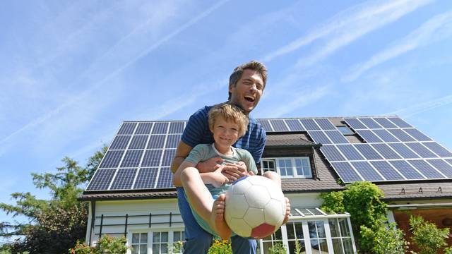 Father,And,Son,Playing,With,Ball,In,Garden,Of,Solar