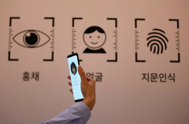 An employee demonstrates a Samsung Electronics