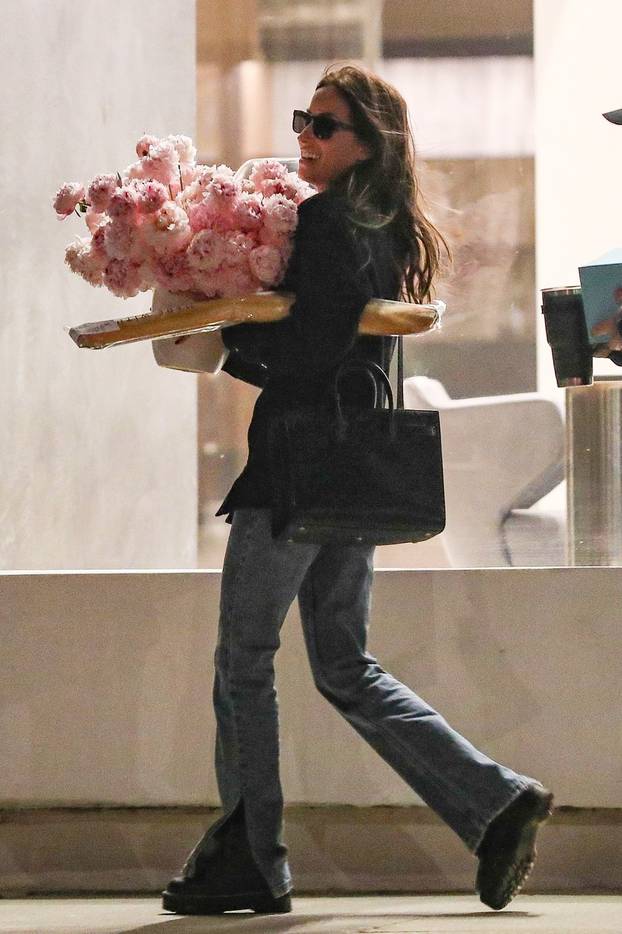 *EXCLUSIVE* Love is in the air for Ines De Ramon who was seen leaving her office with a bouquet of flowers!