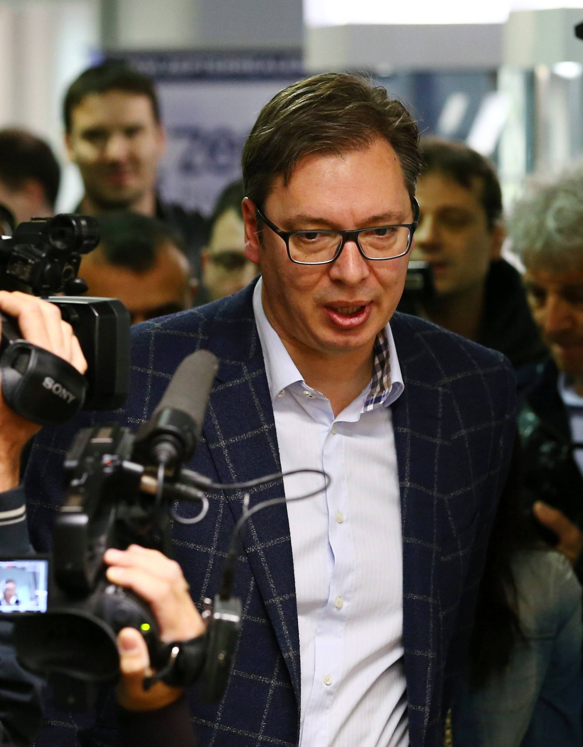 Serbian Prime Minister and presidential candidate Aleksandar Vucic arrives at a polling station during the presidential election in Belgrade