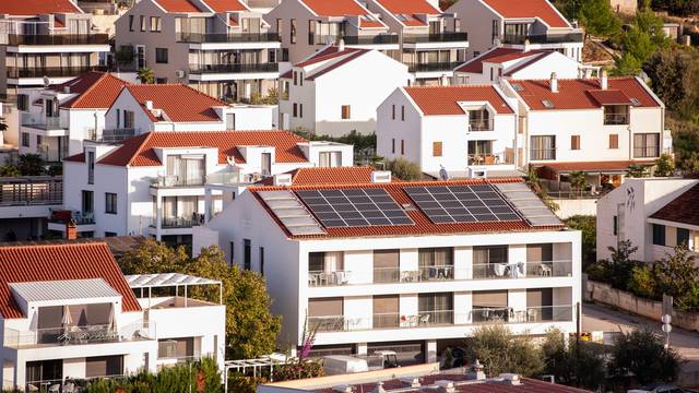 Cluster,Of,Modern,Residential,Buildings,Featuring,Red-tiled,Roofs,,Some,Equipped