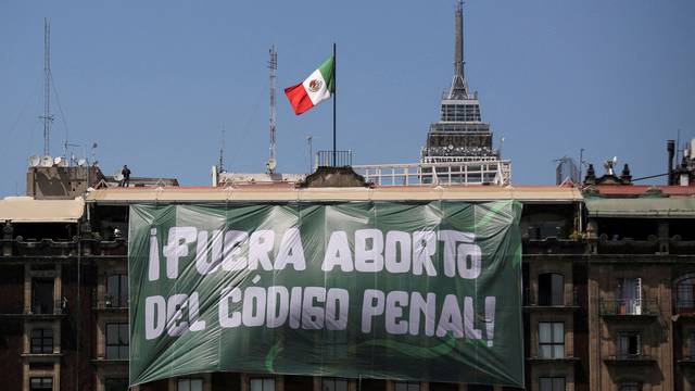 FILE PHOTO: A banner reading: "Abortion Out of the Penal Code" hangs from a building during International Women's Day, at the Zocalo Square in Mexico City, Mexico March 8, 2023. REUTERS/Quetzalli Nicte-Ha/