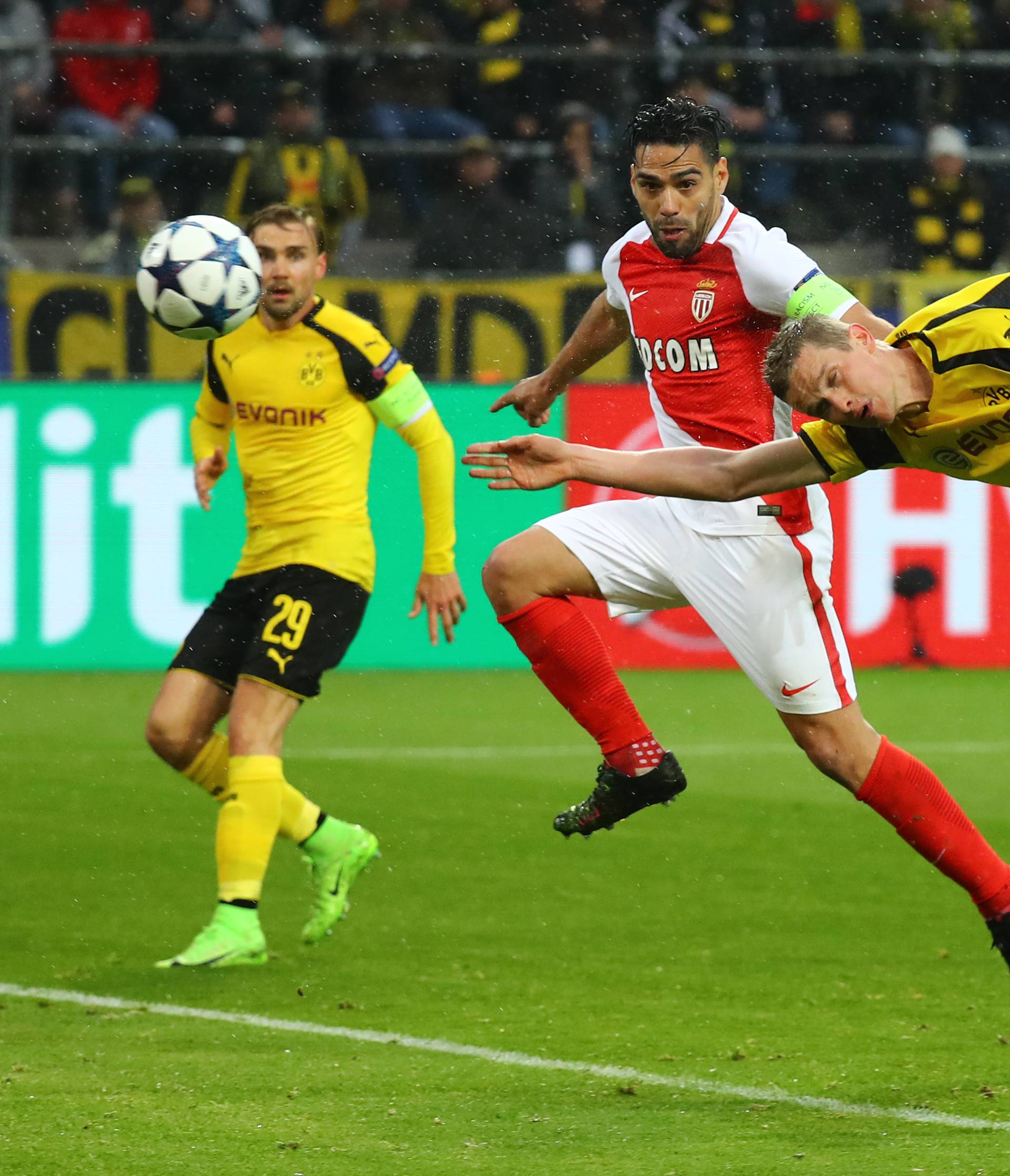 Borussia Dortmund's Sven Bender scores a own goal and the second for Monaco as Monaco's Radamel Falcao looks on