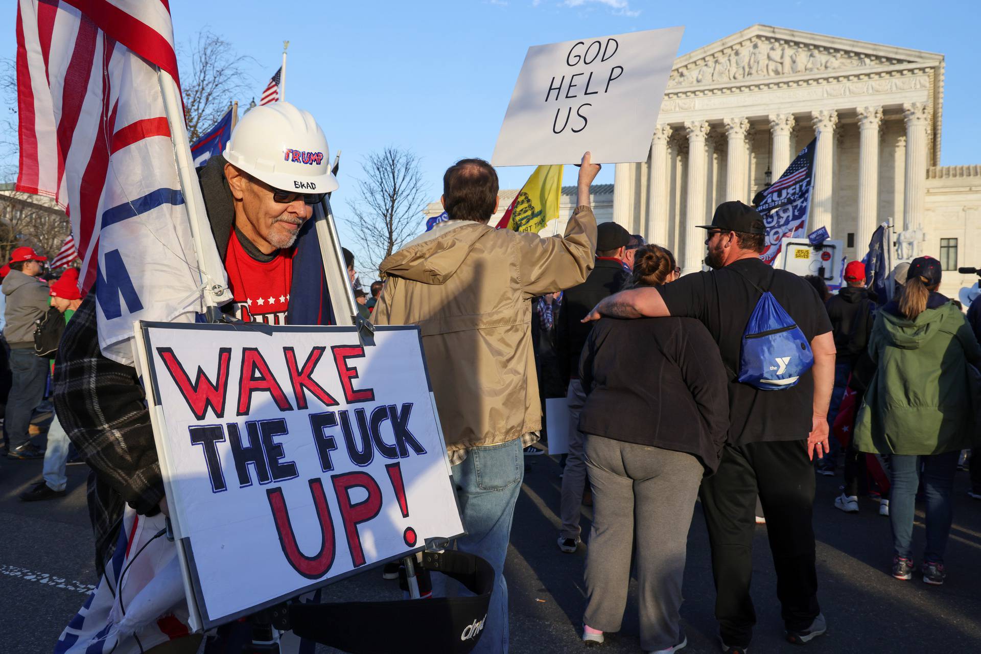 People take part in a rally to protest the results of the election, in Washington