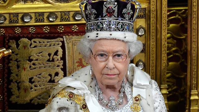 FILE PHOTO: Britain's Queen Elizabeth waits before delivering her speech in the House of Lords, during the State Opening of Parliament at the Palace of Westminster in London