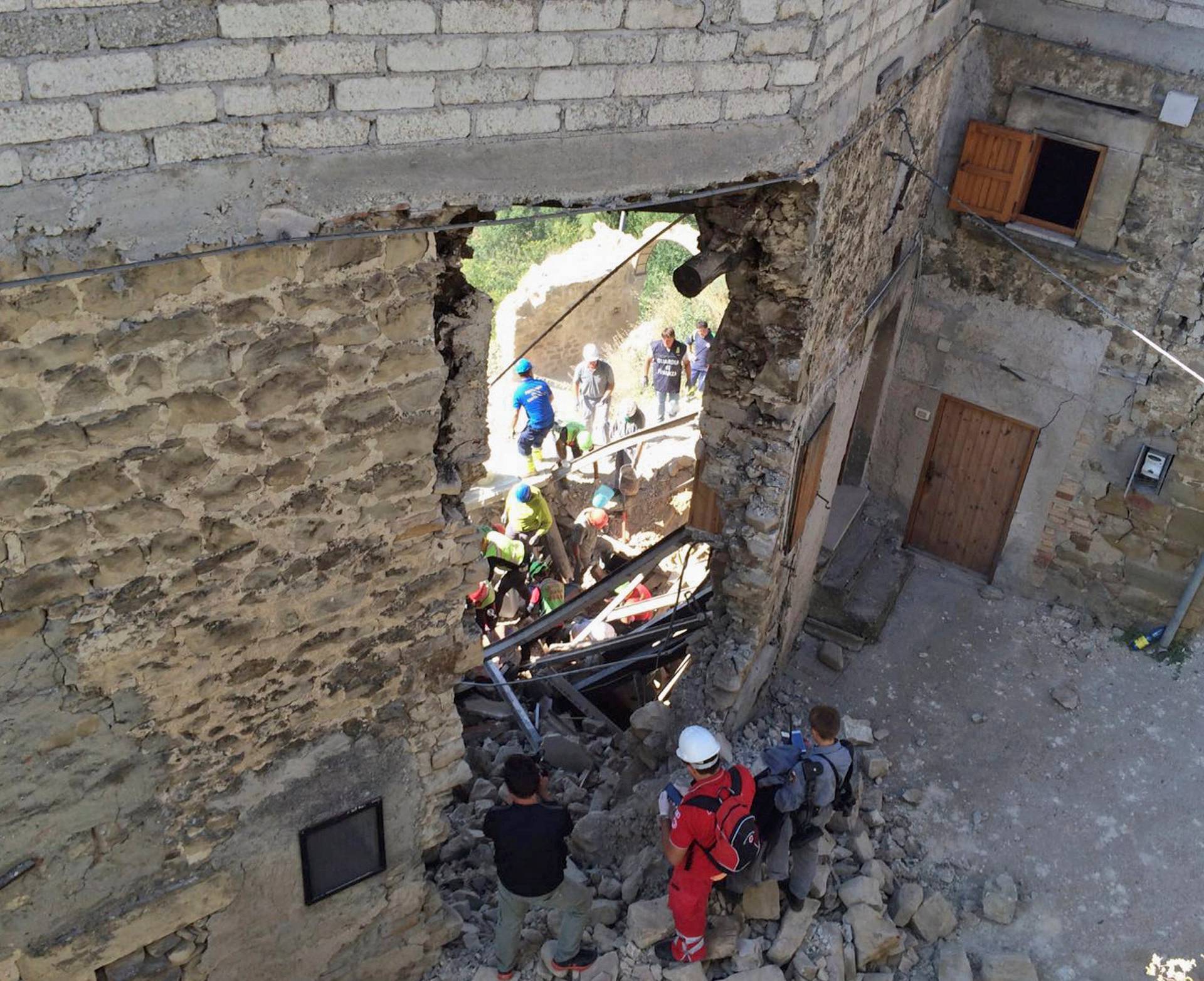 Rescuers work following an earthquake in Accumoli di Rieti