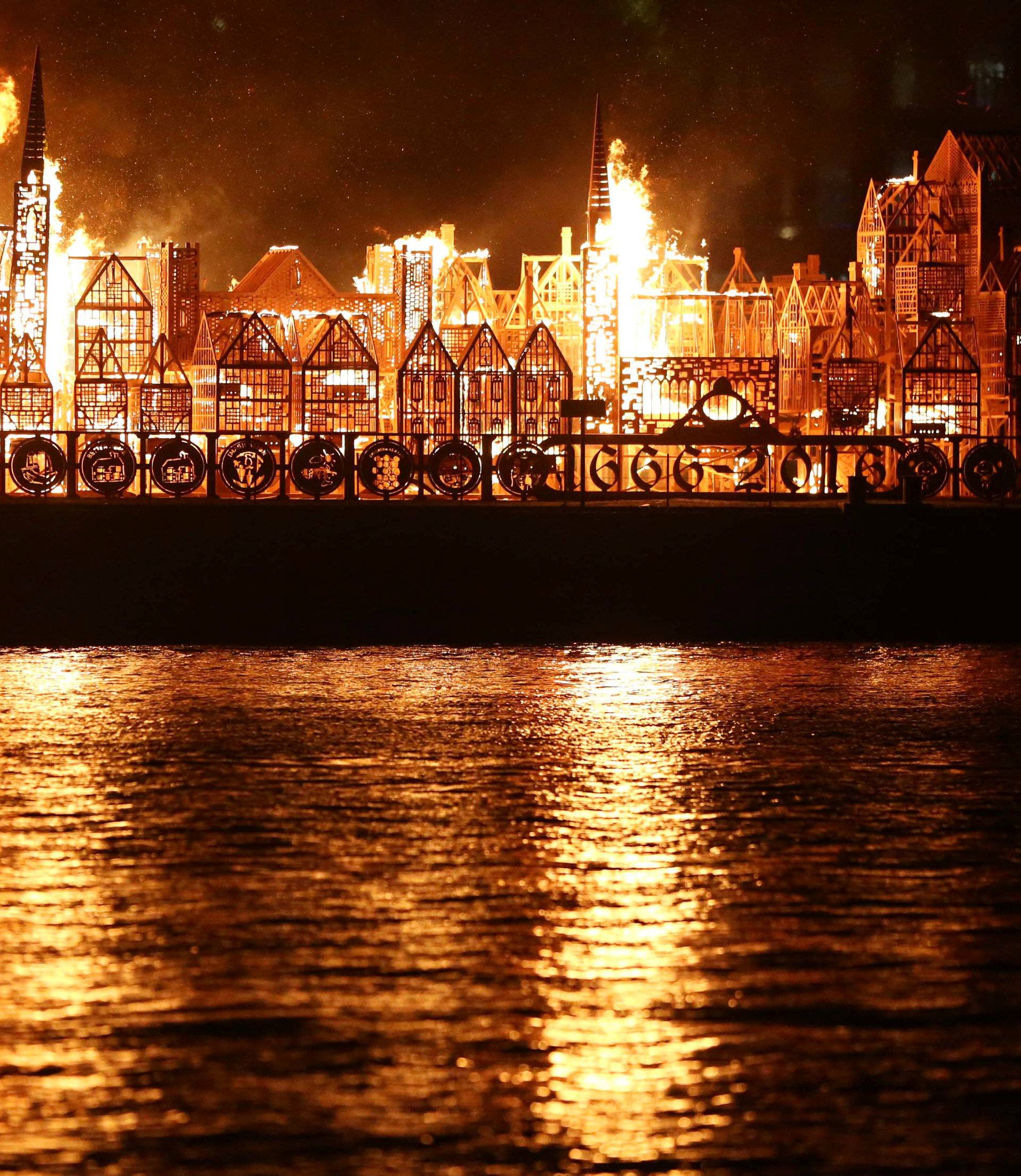 A 120-meter long model of the 17th century London skyline is set alight on the River Thames to commemorate the 1666 Great Fire of London in London