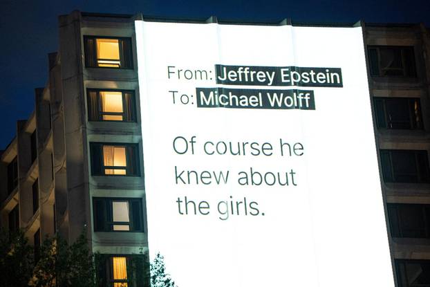 Documents and photos of Jeffrey Epstein and U.S. President Trump projected onto Hilton ahead of WHCA Gala, in Washington, D.C.