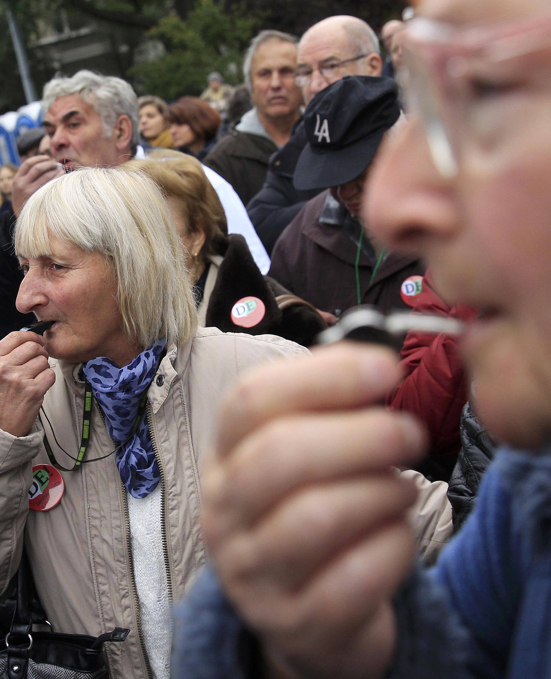 Protesters blow their whistles during an anti-government demonstration in Budapest