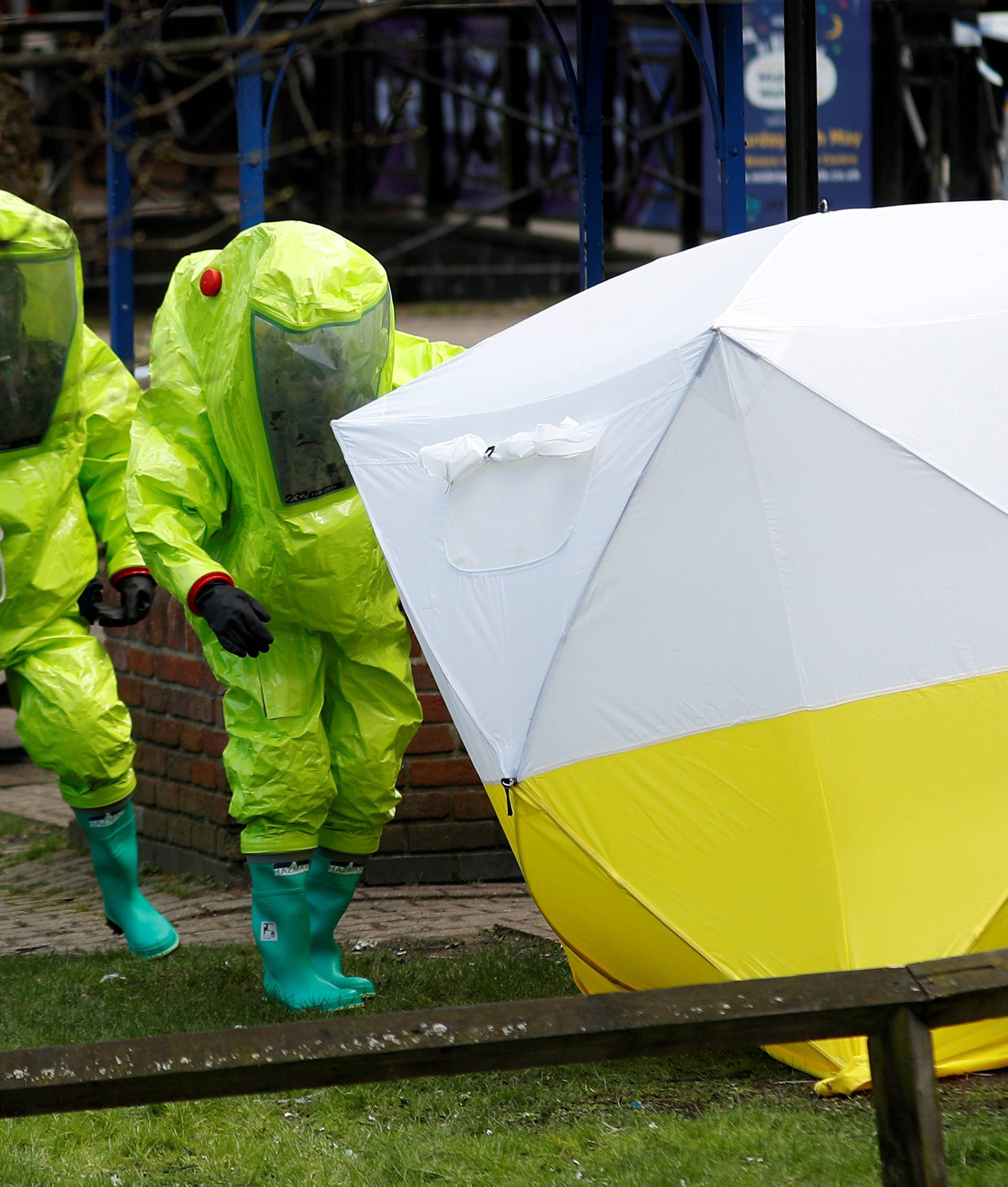 FILE PHOTO: The forensic tent, covering the bench where Sergei Skripal and his daughter Yulia were found, is repositioned by officials in protective suits in the centre of Salisbury