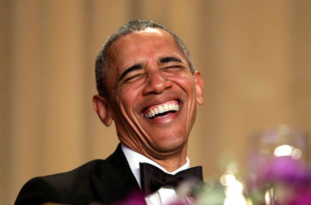 U.S. President Barack Obama laughts at the White House Correspondents