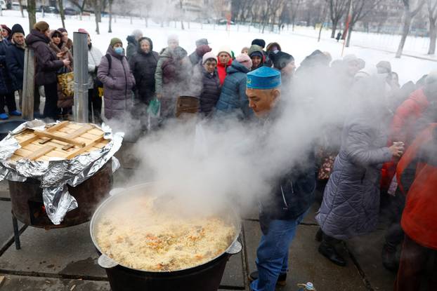 Residents cope with electricity, heating and water outages following Russian attacks on Ukraine's infrastructure in Kyiv