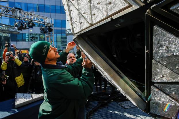 Workers install Waterford Crystal triangles on the Times Square New Year