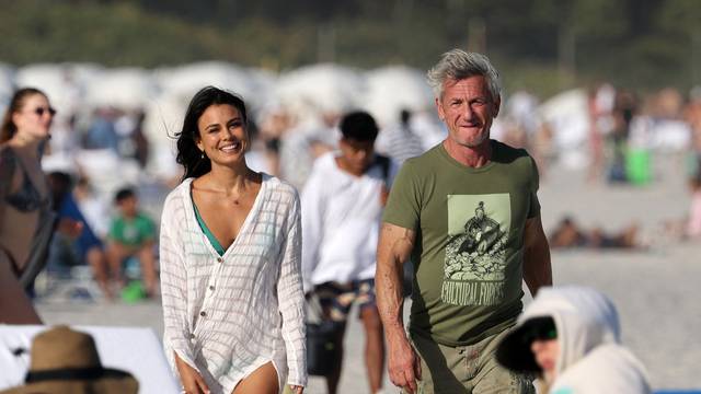 EXCLUSIVE: Sean Penn takes a cozy beach stroll with stunning actress Nathalie Kelley during Art Basel in Miami
