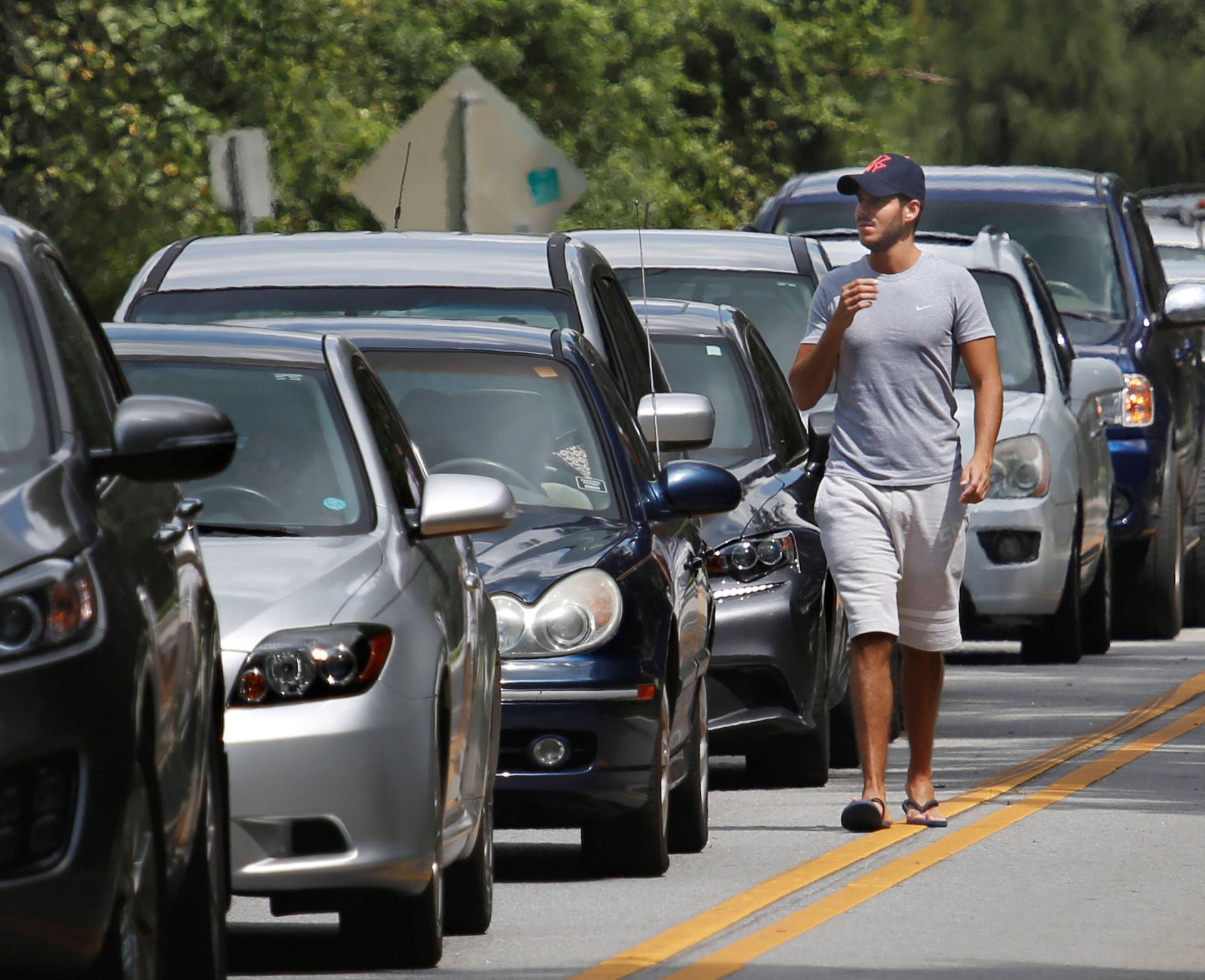 People in their vehicles wait in queue to get sandbags at Kissimmee, in preparation for the arrival of Hurricane Irma making landfall, in Florida