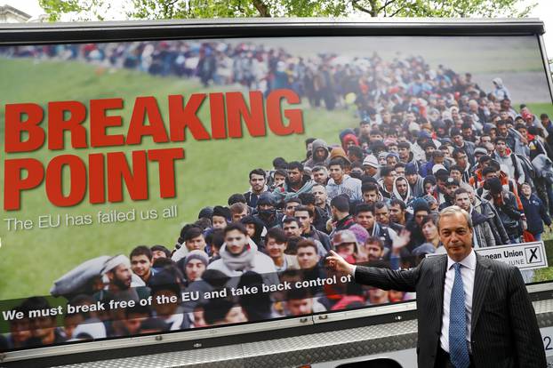 FILE PHOTO: Leader of the United Kingdom Independence Party Farage poses during a media launch for an EU referendum poster in London