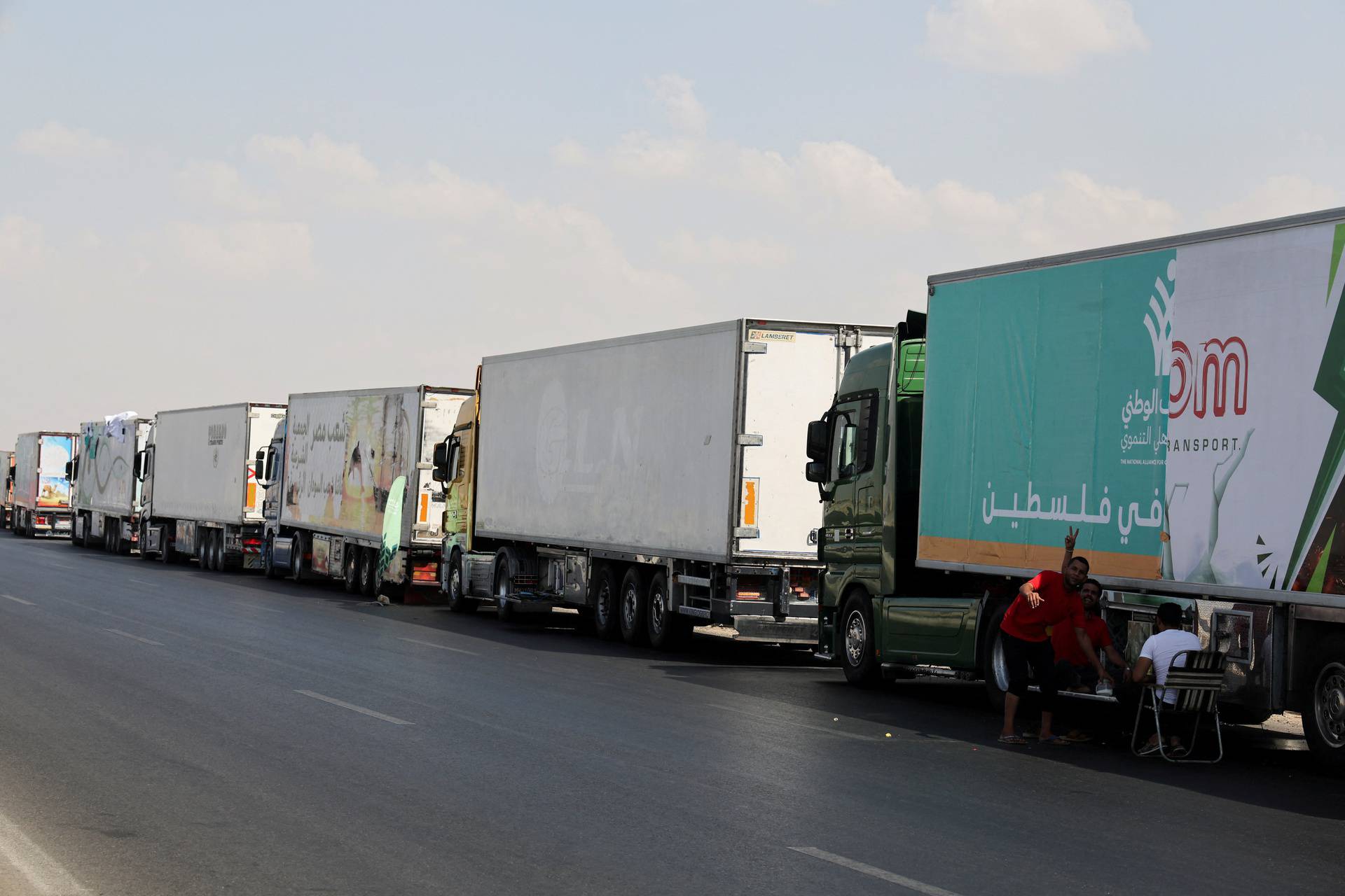 Trucks carrying humanitarian aid to Palestinians are waiting on the desert road (Cairo - Ismailia) on their way to the Rafah crossing