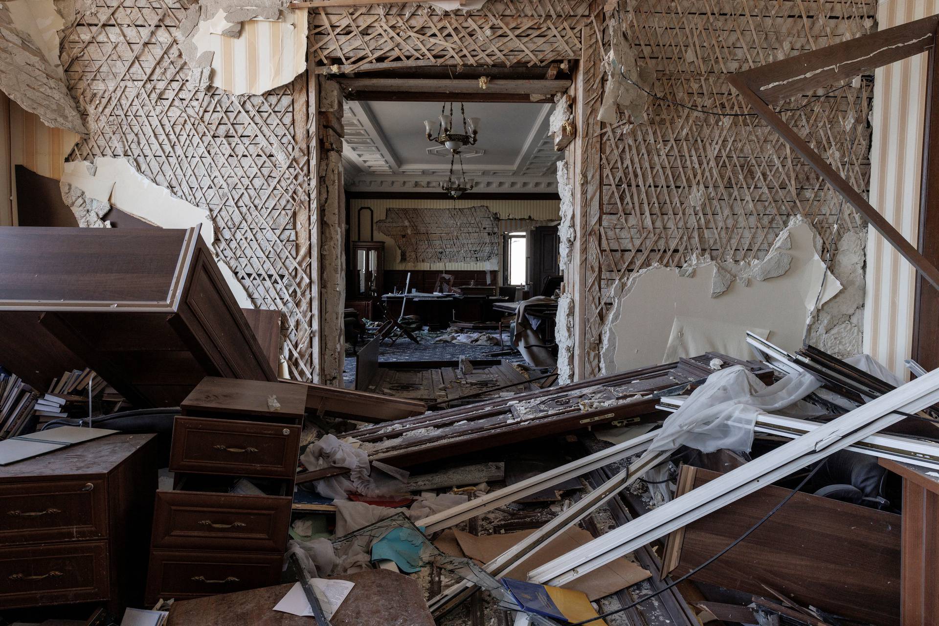 Debris covers the floor of an office in the regional administration building that was severely damaged by shelling in Kharkiv