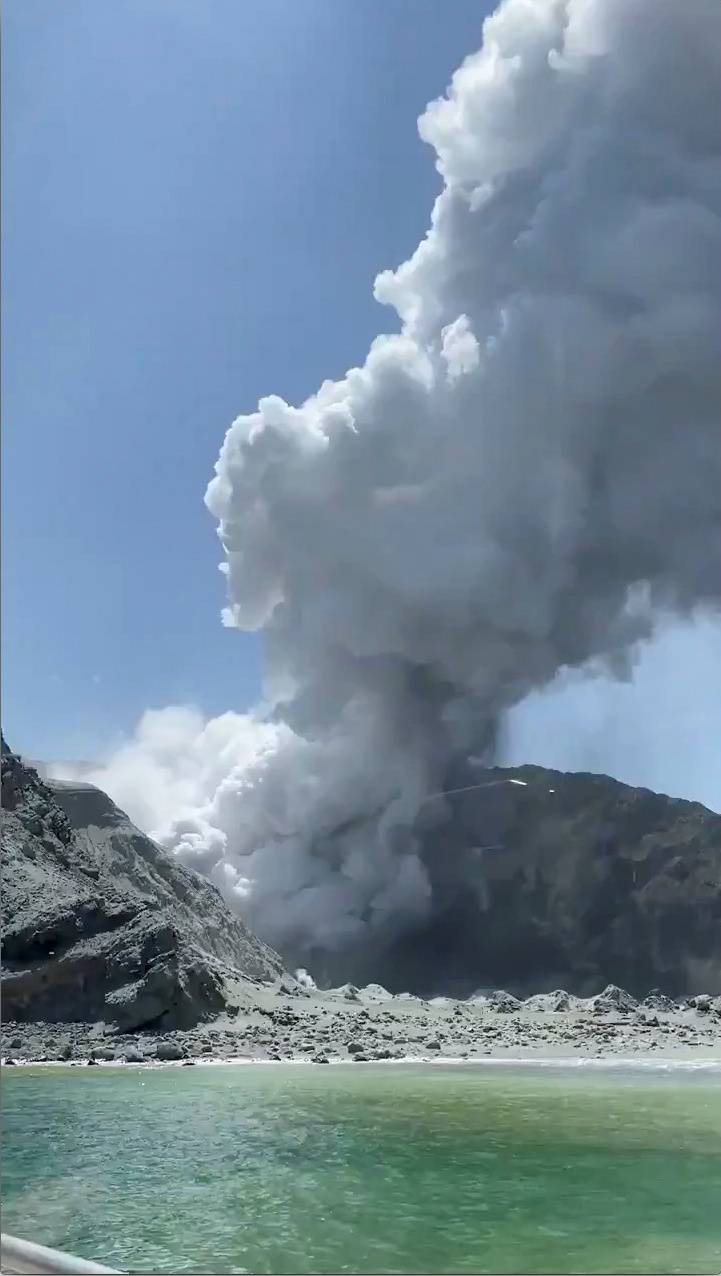 Thick smoke from the volcanic eruption of Whakaari, also known as White Island, is seen from a distance of a vessel in New Zealand