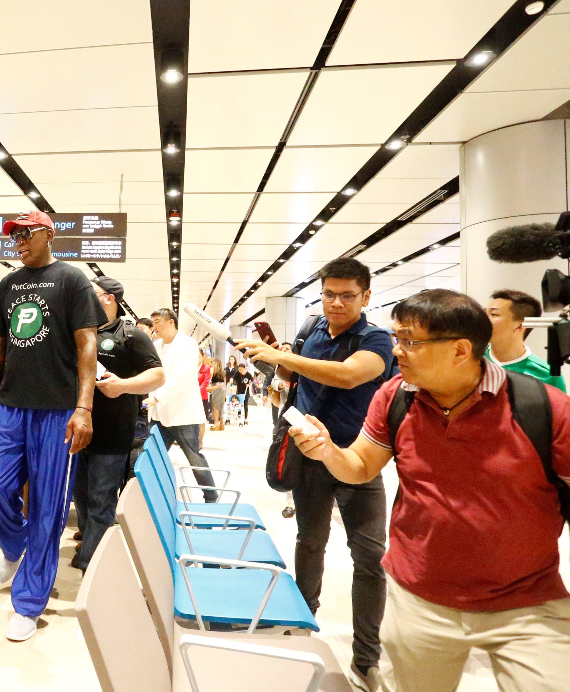 Former basketball player Dennis Rodman arrives at Changi Airport in Singapore