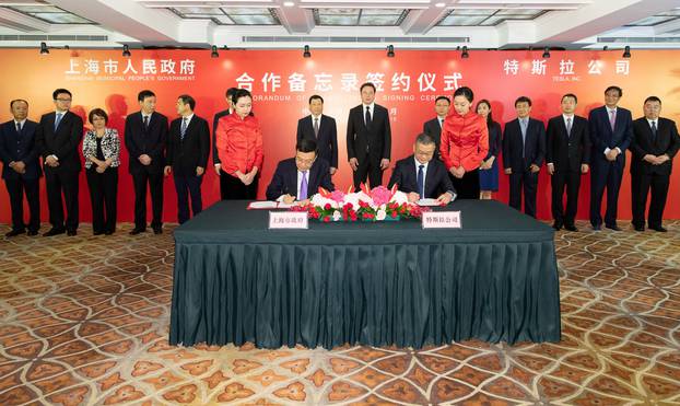 Tesla Inc Chief Executive OfficerÂ ElonÂ Musk and Shanghai Mayor Ying Yong attend a signing ceremony in Shanghai