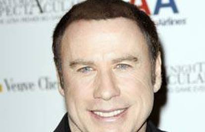 John Travolta ćelavost skriva kosom iz spreja?