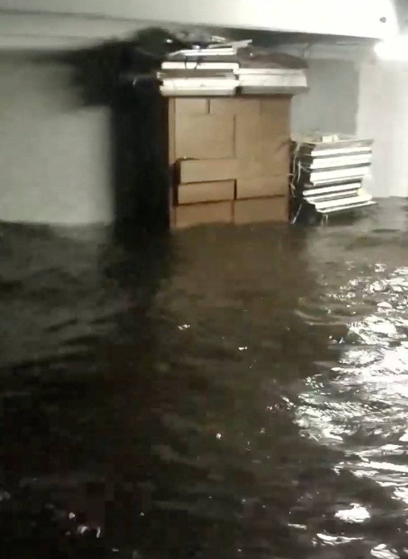 Flood waters are seen in a house in Belhaven in this still image from video obtained from social media
