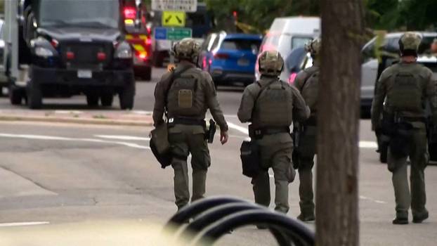 Police work at the scene after an attack that injured multiple people in Boulder