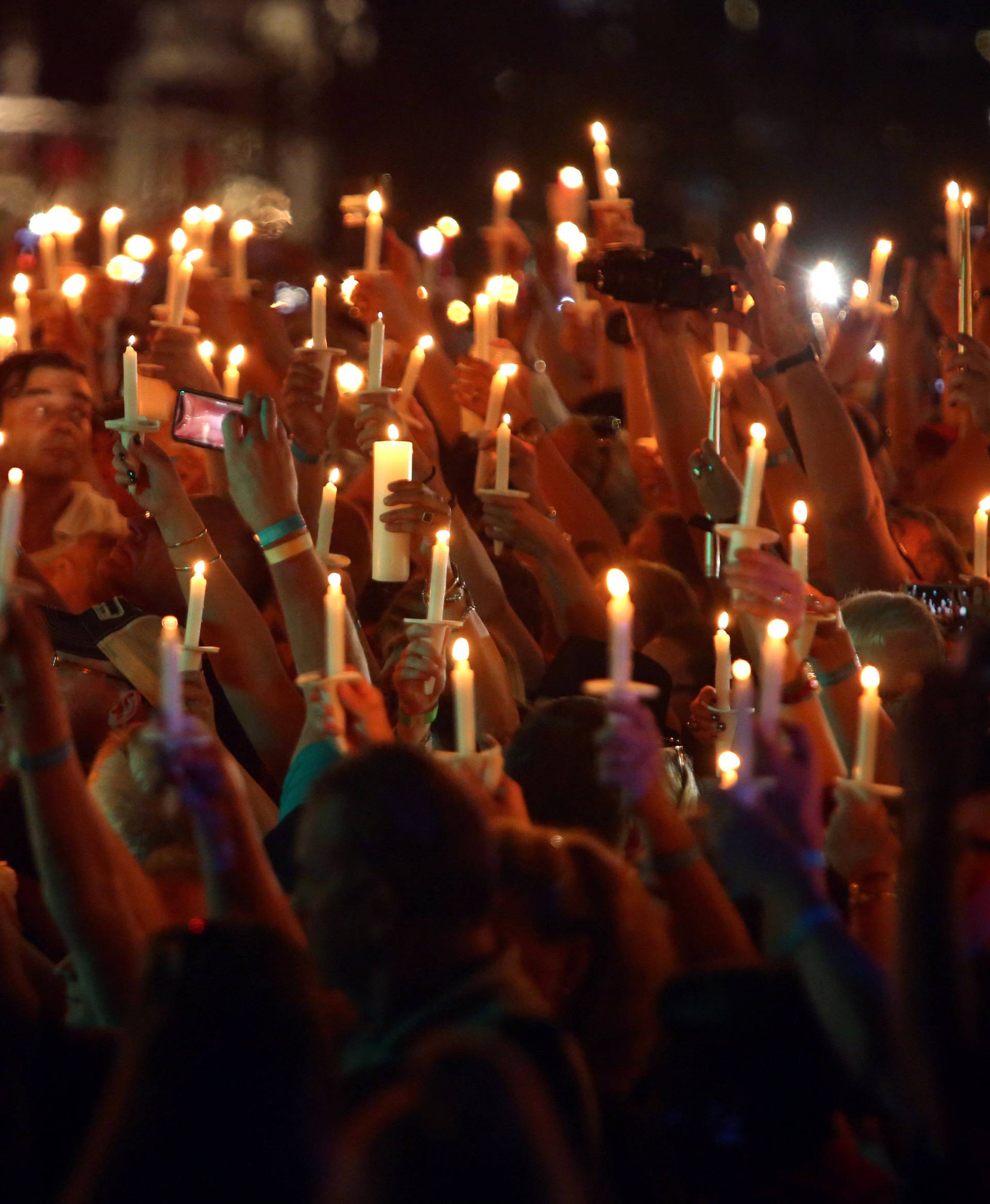 Mourners gather to commemorate the 40th anniversary of the death of singer Elvis Presley in Memphis