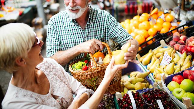 Mature,Shopping,Couple,With,Basket,On,The,Market.,Healthy,Diet.
