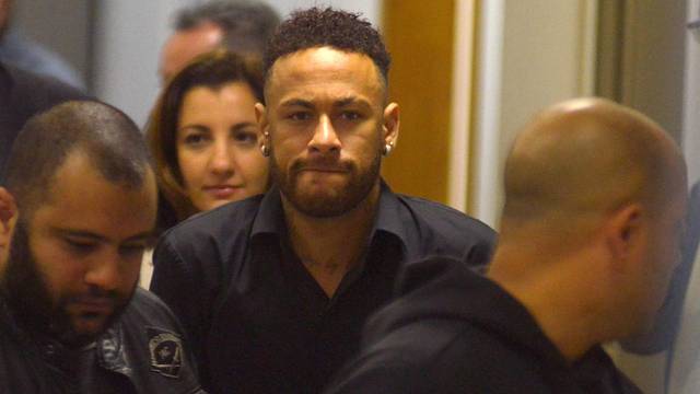 Brazilian soccer player Neymar leaves the police station after testifying in Rio de Janeiro