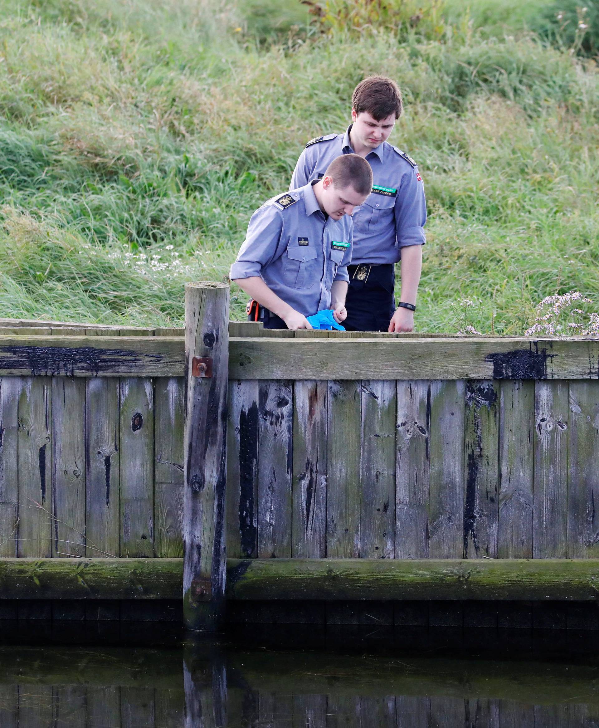 Members of the Danish Emergency Management Agency assist police in the search in the Kim Wall case at Kalvebod Faelled in Copenhagen