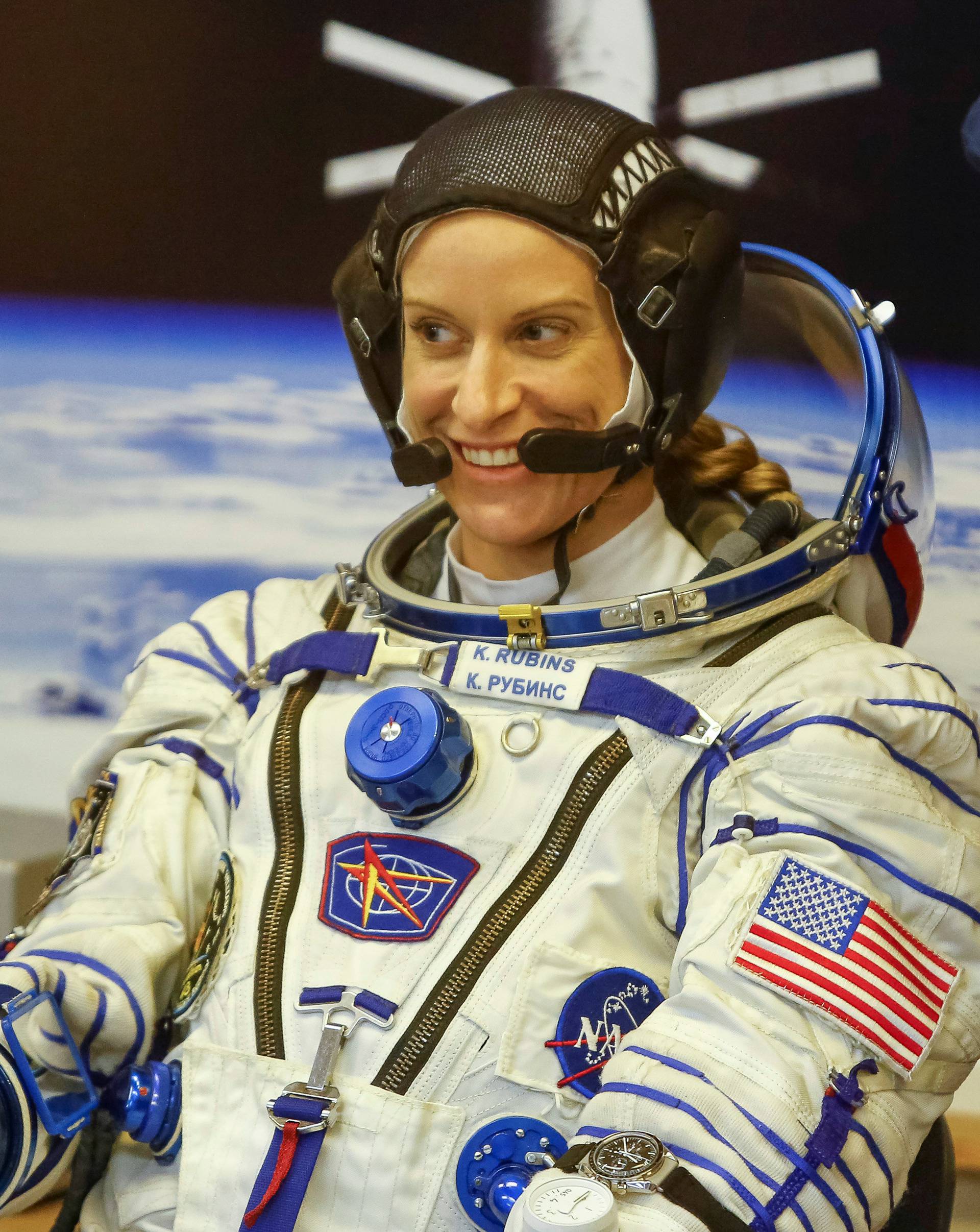 The International Space Station (ISS) crew member Kate Rubins of the U.S. gives thumb up after donning space suits at the Baikonur cosmodrome, Kazakhstan