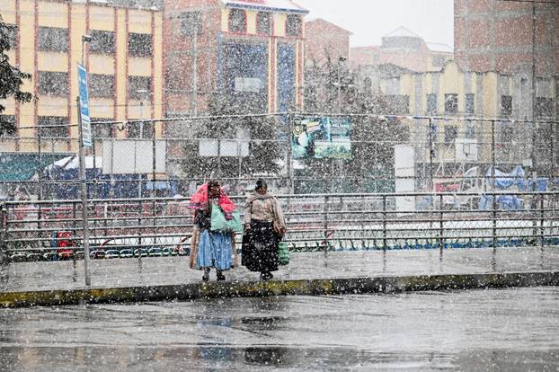 Snow falls amid low temperatures in Bolivia, in El Alto