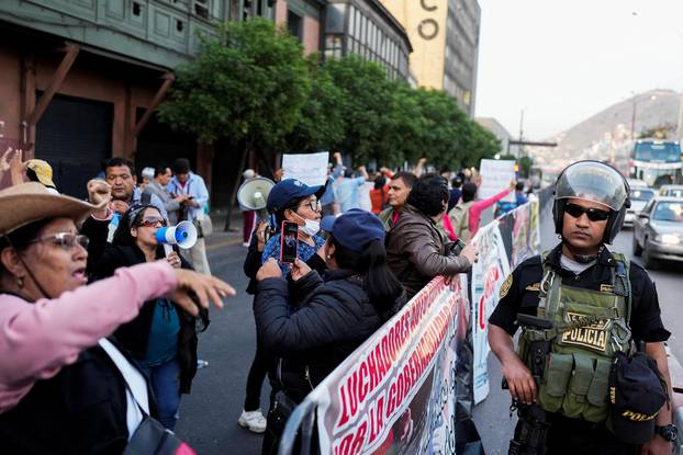 Supporters of Peru's President Pedro Castillo protest outside of Congress, in Lima