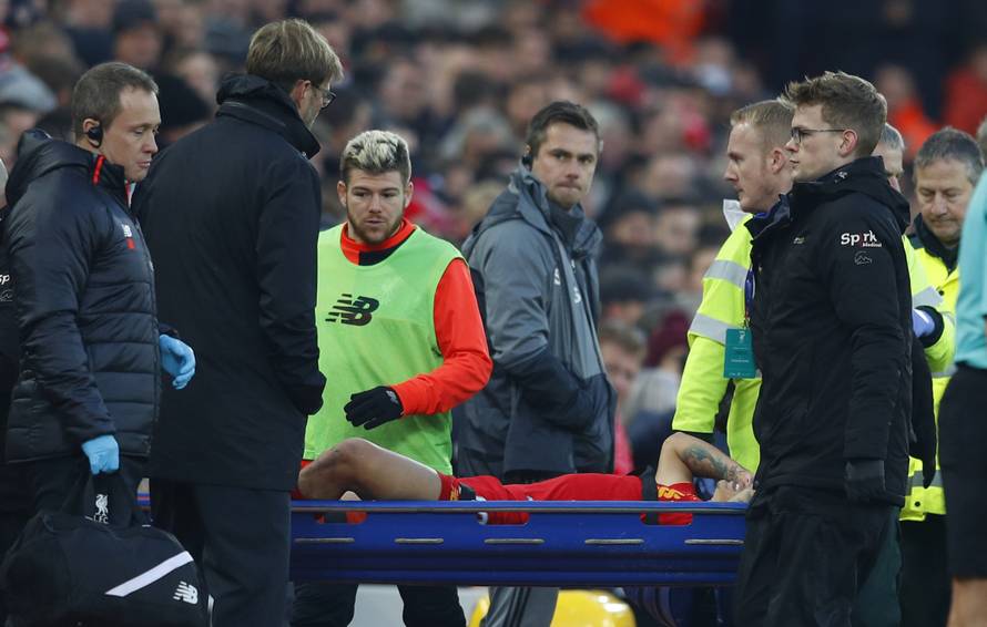 Liverpool's Philippe Coutinho is stretchered off after sustaining an injury as manager Juergen Klopp looks on