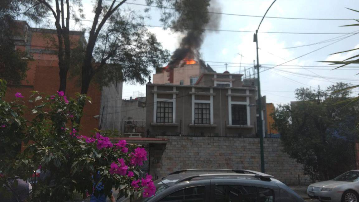 A building is seen on fire following an earthquake in Mexico city
