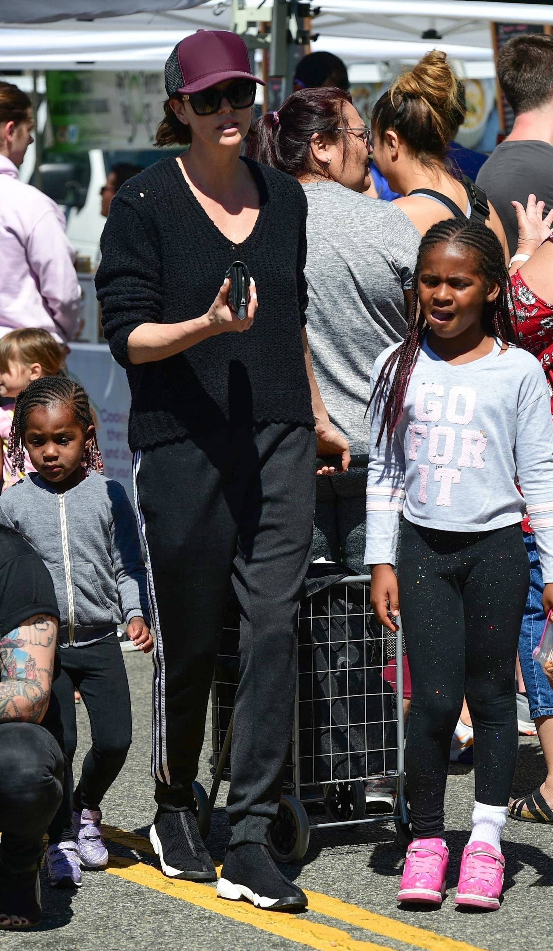 Charlize Theron shops with her kids at the Farmer's Market in Studio City