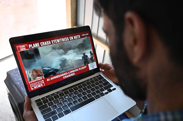 PhotoFlash | London bound Air India plane with 242 people onboard crashes near airport in India's Gujarat