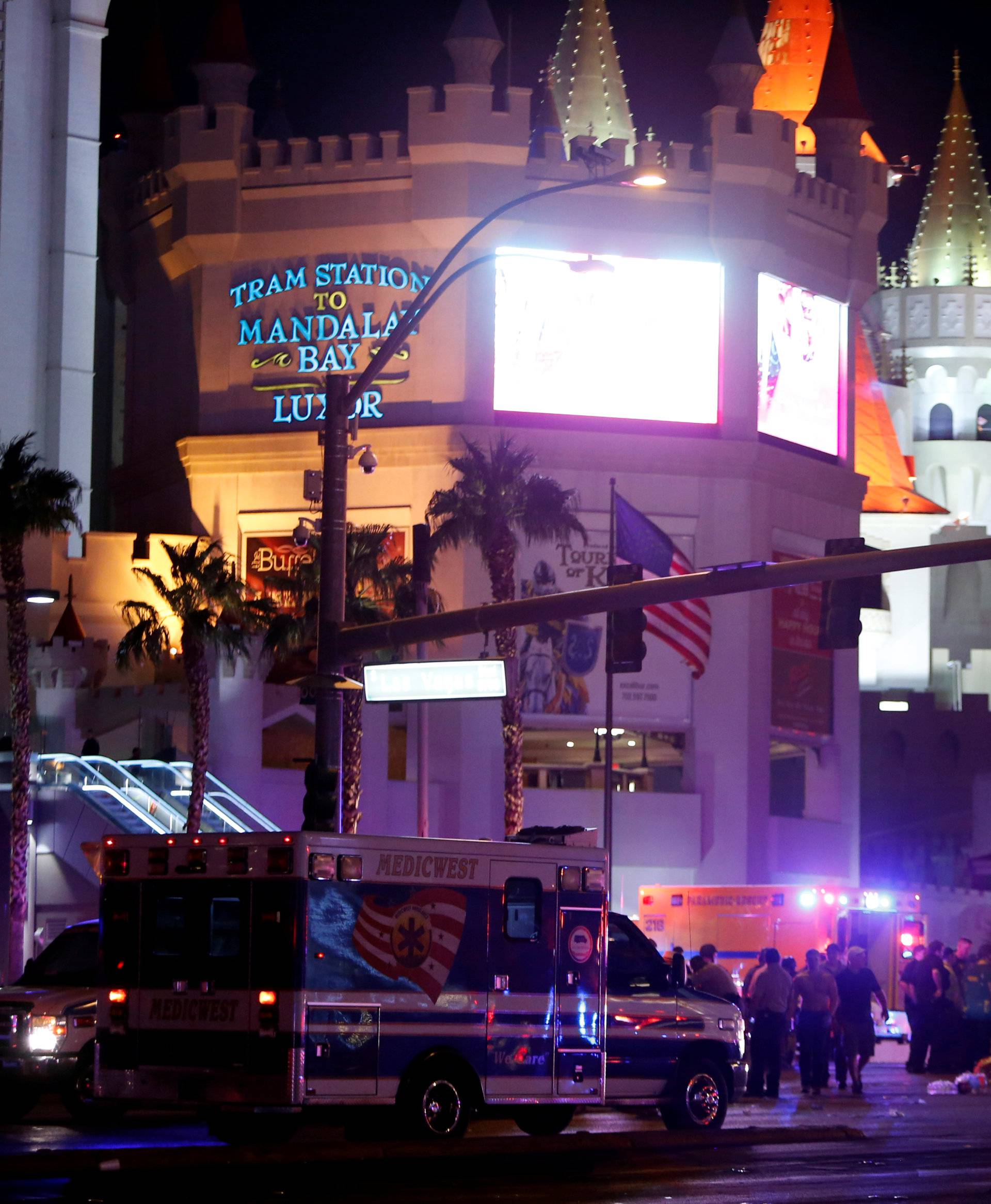 Las Vegas Metro Police and medical workers stage in the intersection of Tropicana Avenue and Las Vegas Boulevard South after a mass shooting at a music festival on the Las Vegas Strip in Las Vegas
