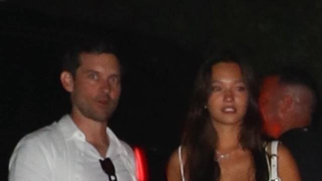 New couple alert! Tobey Maguire was seen with 20-year-old Actress/Model Lily Chee at Michael Rubin's 4th of July bash