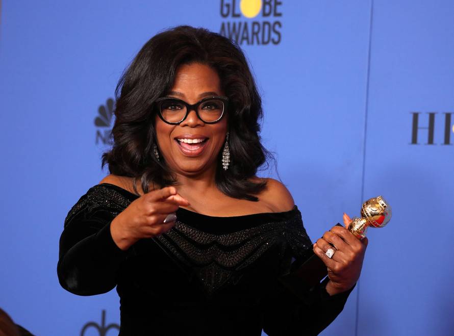 FILE PHOTO: Oprah Winfrey with her Cecil B. DeMille Award at the 75th Golden Globe Awards in Beverly Hills