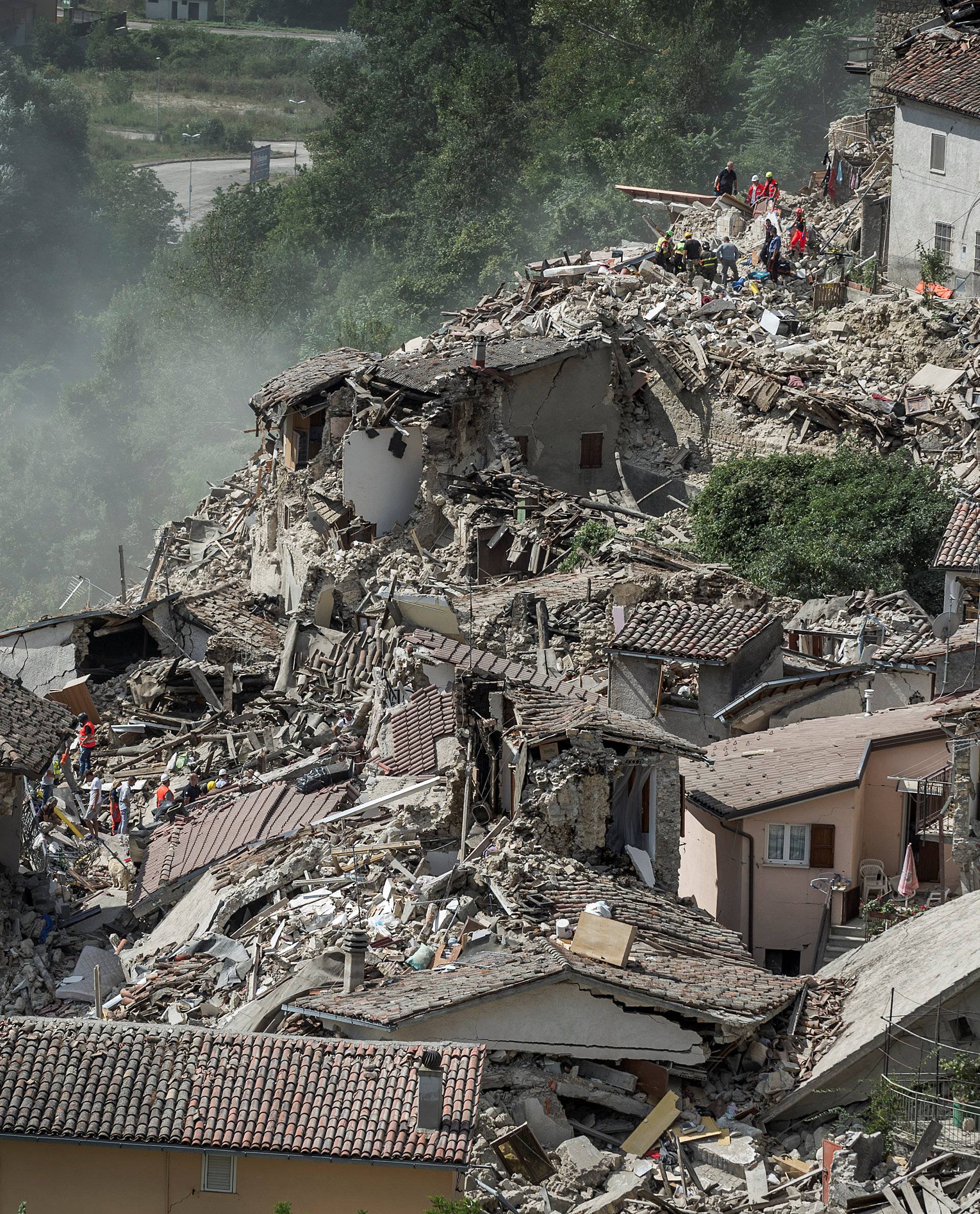 Rescuers work following an earthquake in Pescara del Tronto
