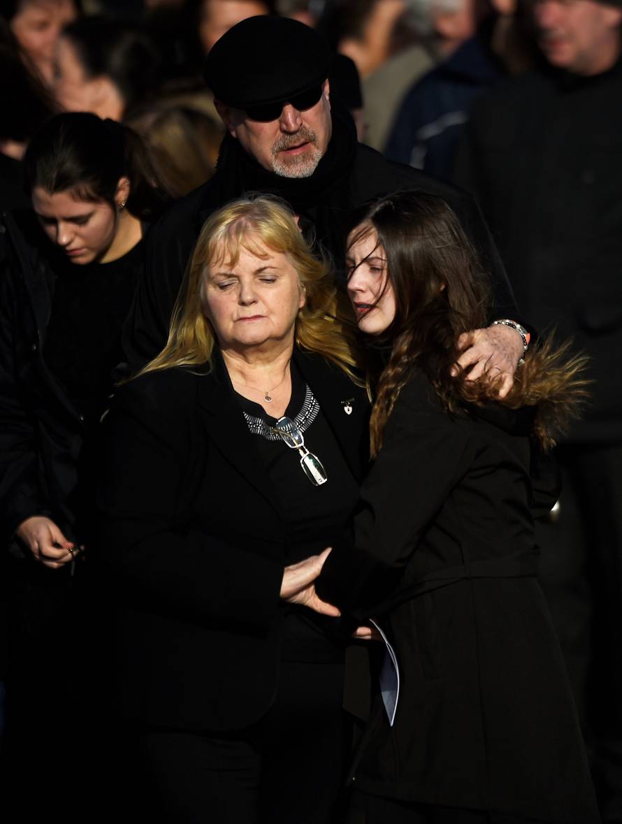 Eillen O'Riordan leaves her daughter Dolores O'Riordan's funeral with Dolores' ex-husband Don Burton and one of their daughters at St Ailbe's Church in Ballybricken