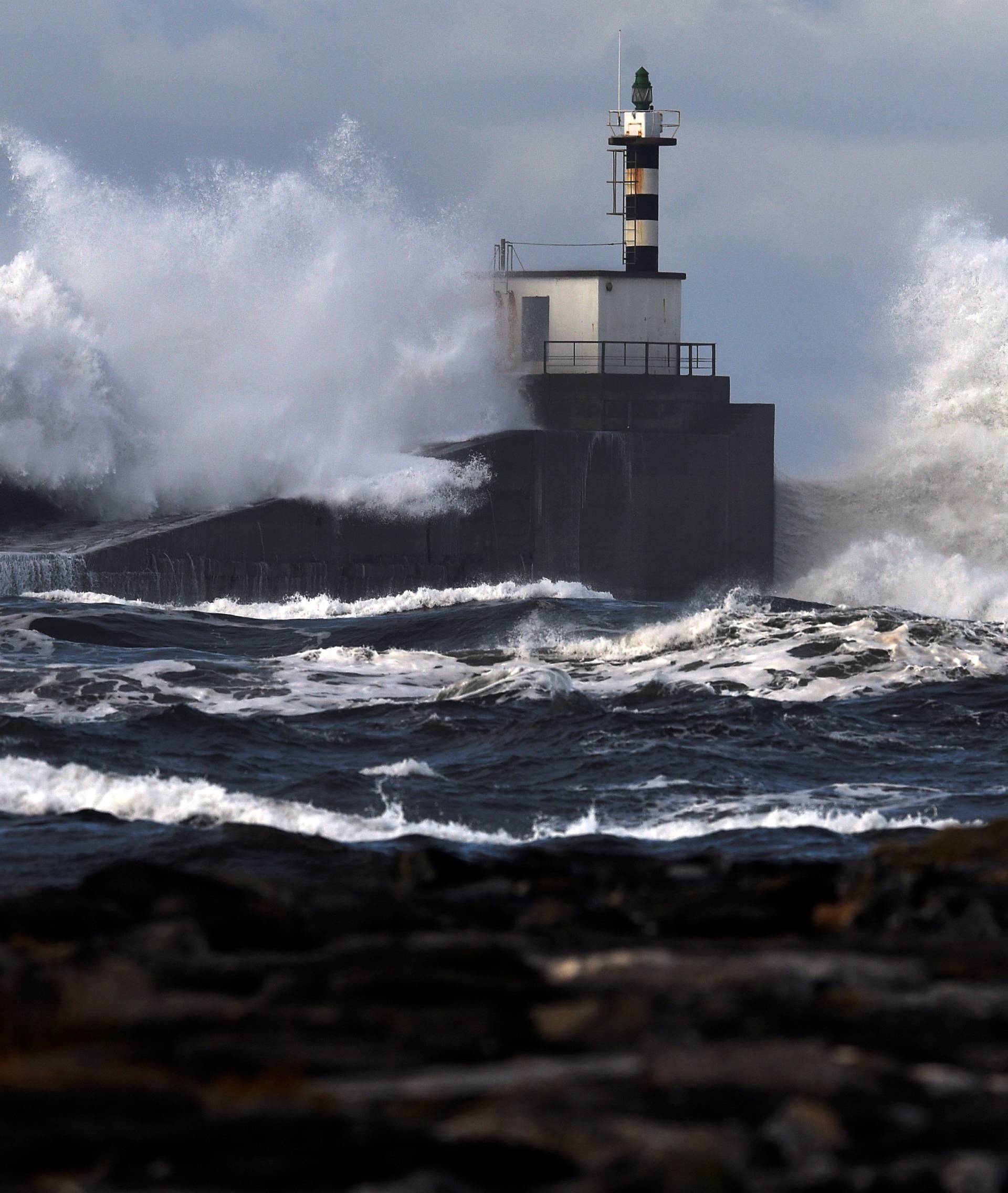 Huge waves crash on the San Esteban de Pravia seafront in the northern Spanish region of Asturias