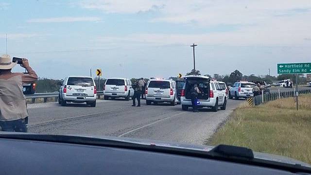 Police cars are seen at Sutherland Springs