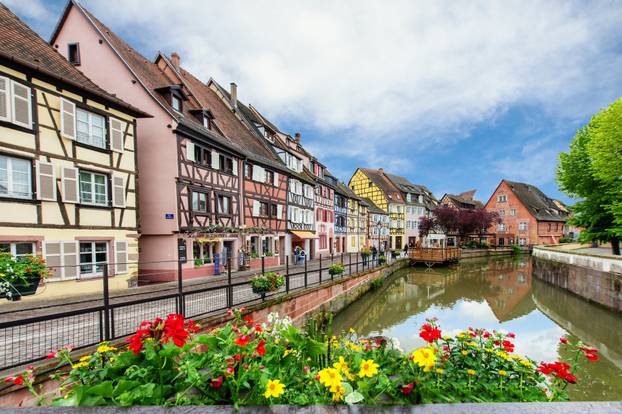 Colorful traditional french houses on the side of river Lauch in