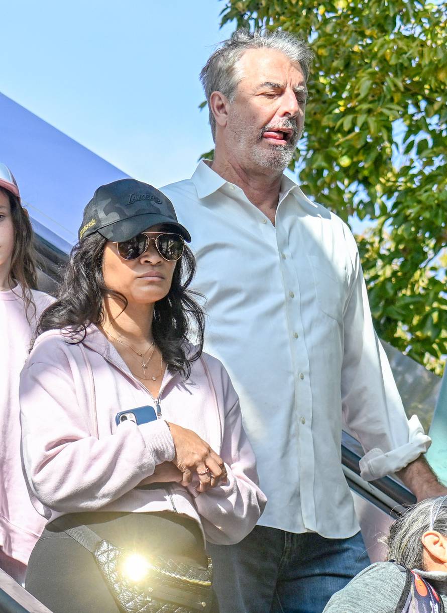 EXCLUSIVE: Chris Noth enjoys a day at Universal Studios with his wife and son