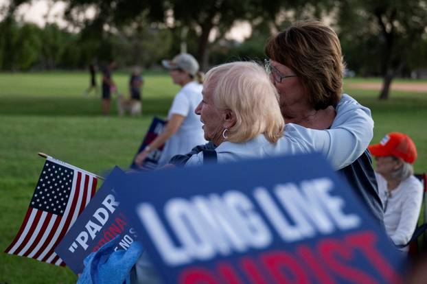 Catholics from across the Phoenix area gather to pray for Charlie Kirk, who was shot and killed in Utah, at Desert Horizon Park in Scottsdale