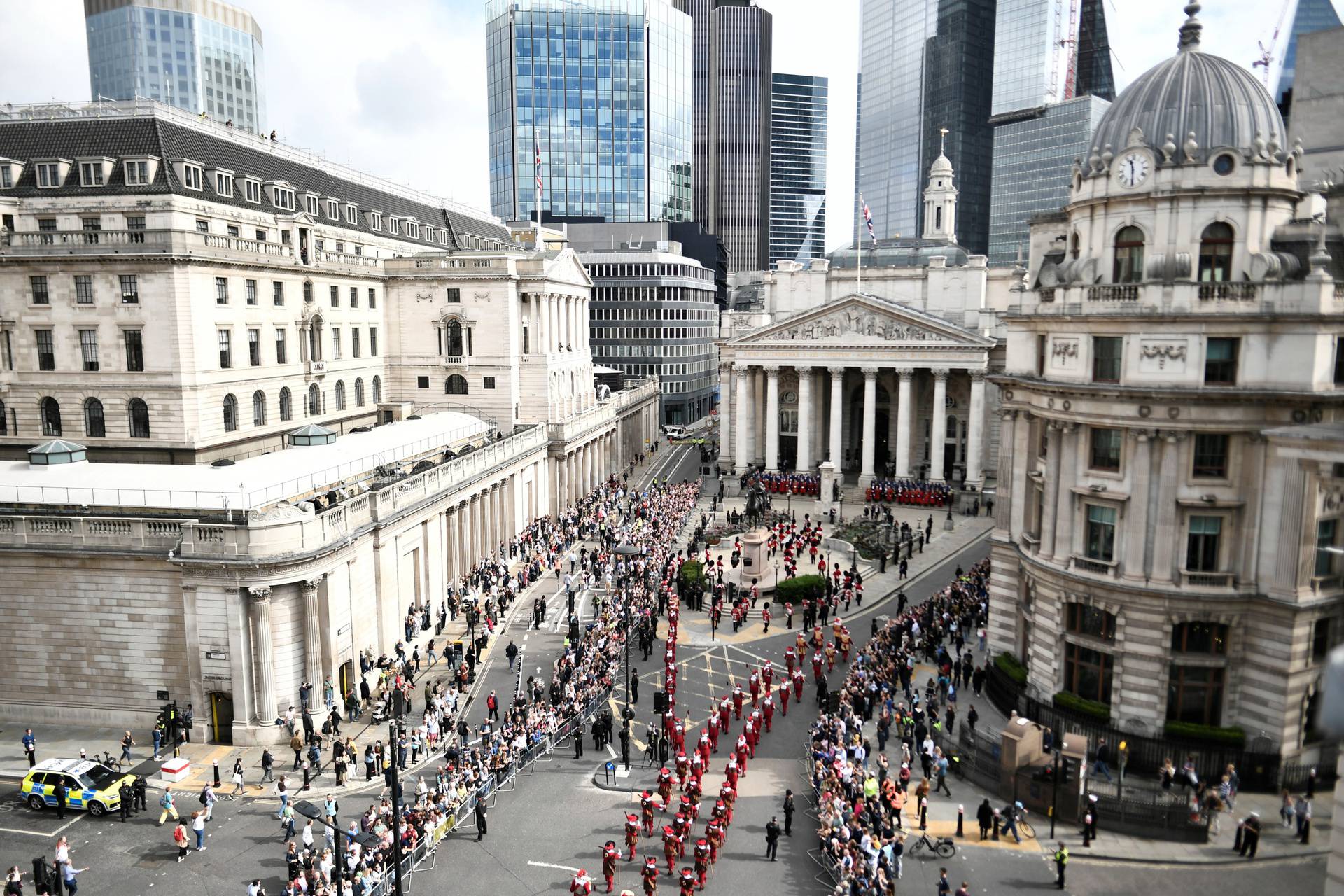 Members of the public and members of the military in ceremonial uniform attend the second Proclamation of Britain's new King, King Charles III, at the Royal Exchange, in the City of London, on September 10, 2022. - King Charles III pledged to follow his m
